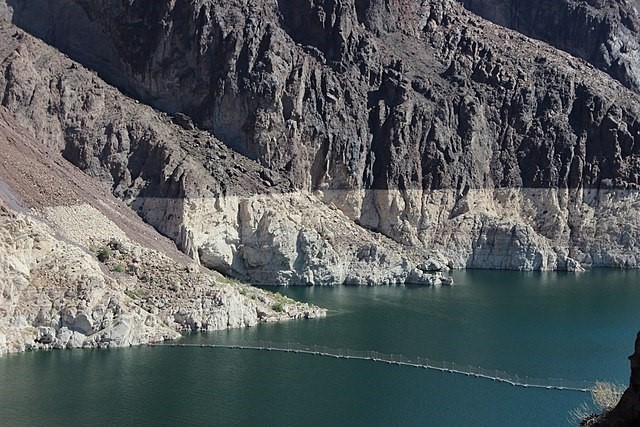 River lined by rocky slopes