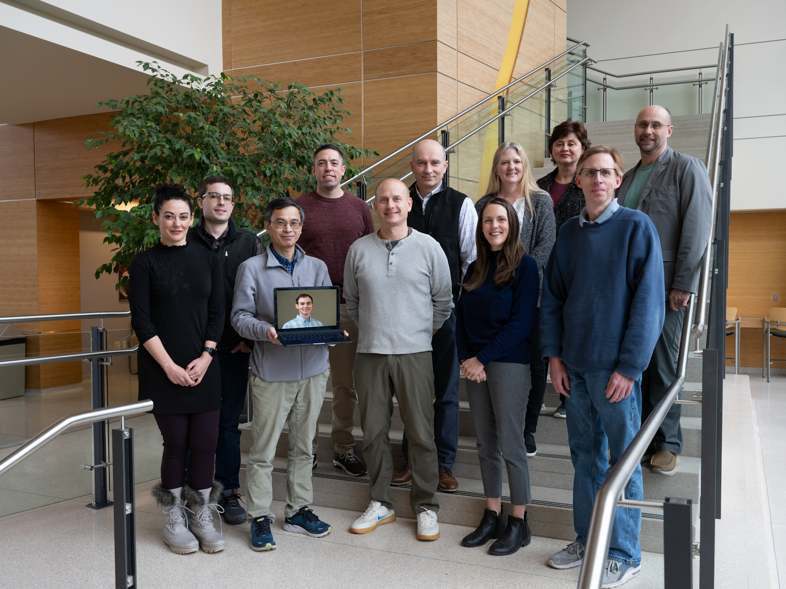 MoTrPAC group members standing together on a set of stairs
