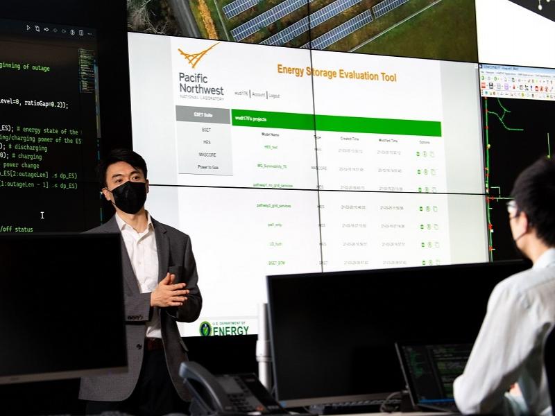 Thumbnail image of researchers discussion hydrogen energy storage evaluation tool.