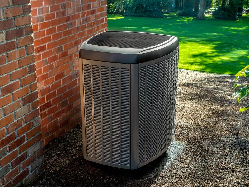 A heat pump adjacent to a home