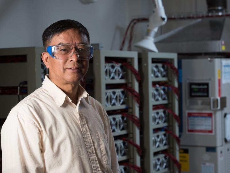 Man in white shirt and safety glasses