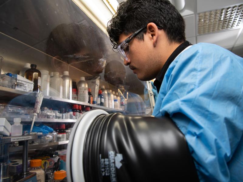 Ricardo Sandoval, dressed in full lab safety gear.